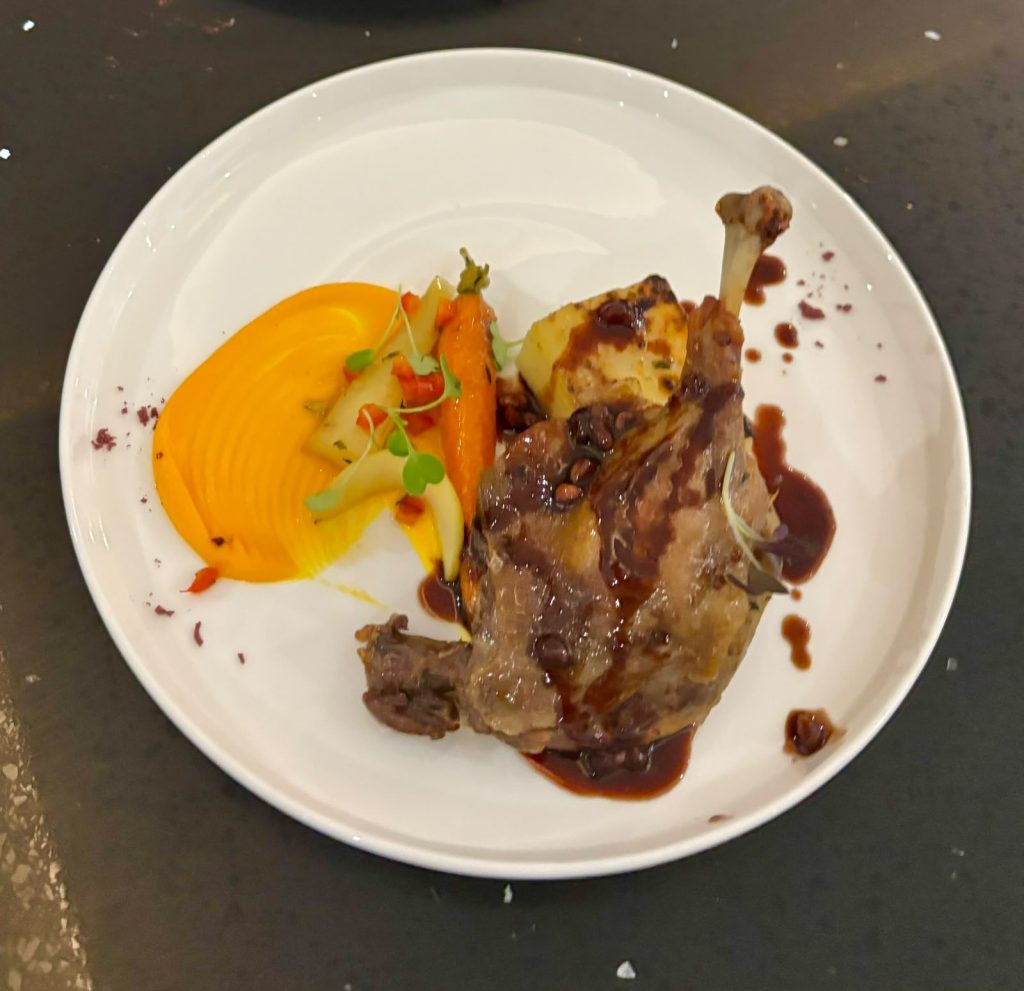 Confit duck leg with butternut puree and jus