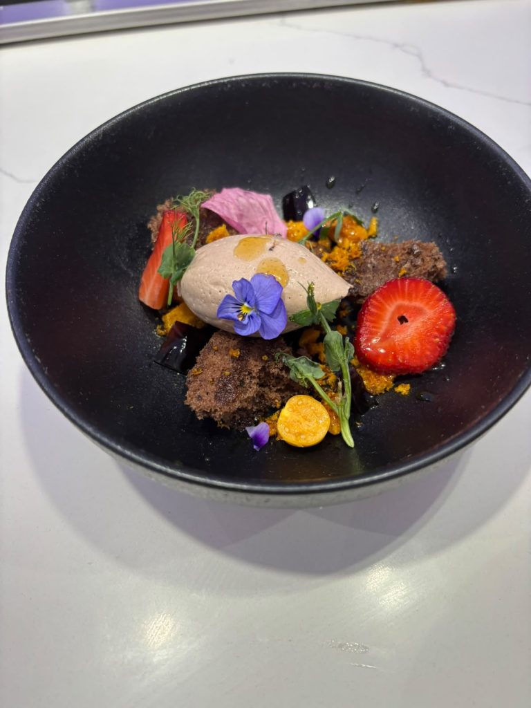 Chocolate delice with sorbet, strawberry and edible flowers